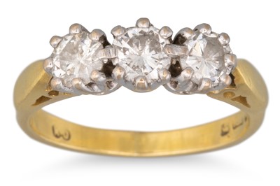 Lot 57 - A THREE STONE DIAMOND RING, mounted in 18ct...