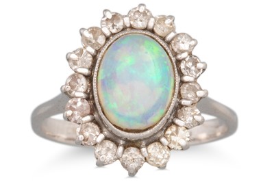 Lot 27 - AN OPAL AND DIAMOND CLUSTER RING, the oval...