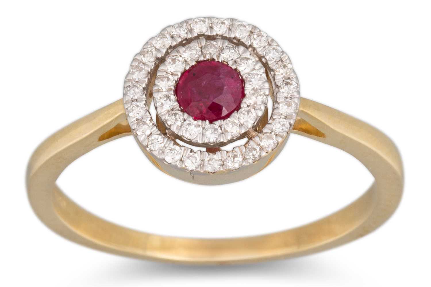 Lot 28 - A DIAMOND AND RUBY TARGET RING, mounted in