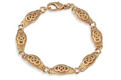 Lot 76 - A 9CT GOLD BRACELET, with Celtic engraving, 20....