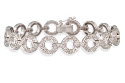 Lot 89 - A DIAMOND CLUSTER BRACELET, the diamond set...