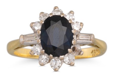 Lot 90 - A DIAMOND AND SAPPHIRE CLUSTER RING, the oval...