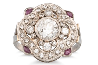 Lot 218 - A RUBY AND DIAMOND CLUSTER RING, the central...