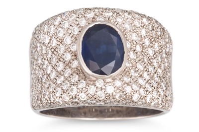 Lot 251 - A SAPPHIRE AND DIAMOND RING, the oval sapphire...