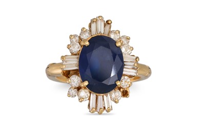 Lot 201 - A DIAMOND AND SAPPHIRE CLUSTER RING, the oval...