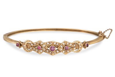 Lot 258 - A RUBY AND DIAMOND BANGLE, in 9ct yellow gold,...