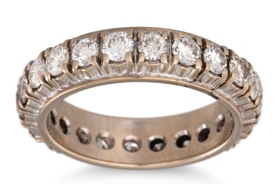 Lot 323 - A DIAMOND ETERNITY RING, the brilliant cut...