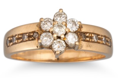 Lot 111 - A DIAMOND SEVEN STONE CLUSTER RING, mounted in...