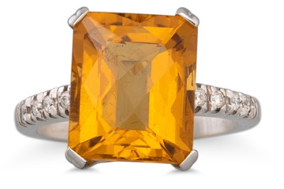 Lot 310 - A TOPAZ AND DIAMOND RING, the mixed cut topaz...