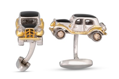 Lot 337 - A PAIR OF ONYX CUFFLINKS, modelled as motor...