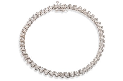 Lot 249 - A DIAMOND LINE BRACELET, mounted in 14ct white...