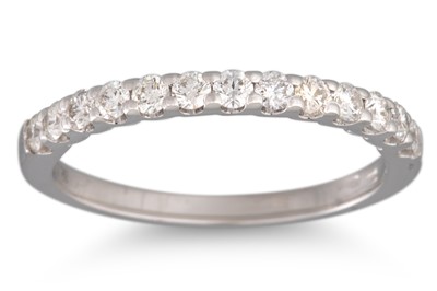 Lot 120 - A DIAMOND HALF ETERNITY RING, the brilliant...