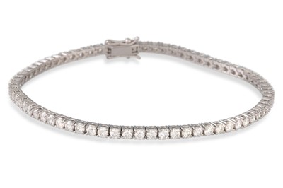 Lot 159 - A DIAMOND LINE BRACELET, the brilliant cut...