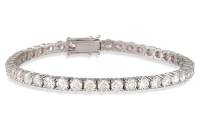 Lot 160 - A DIAMOND LINE BRACELET, the brilliant cut...