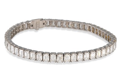 Lot 161 - A DIAMOND LINE BRACELET, the emerald cut...