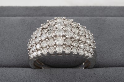 Lot 135 - A DIAMOND DRESS CLUSTER RING, mounted in 9ct...