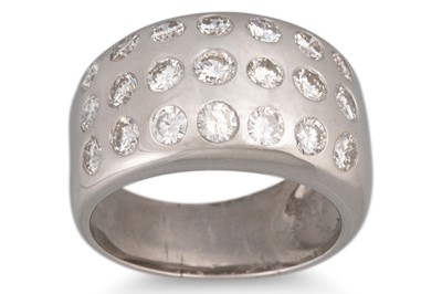 Lot 308 - A THREE ROWED DIAMOND RING, the brilliant cut...