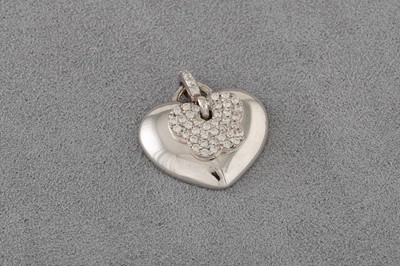 Lot 155 - A DIAMOND SET PENDANT, in the form of a heart...