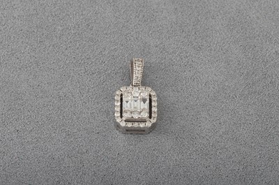 Lot 178 - A DIAMOND SET PENDANT, the baguette and...