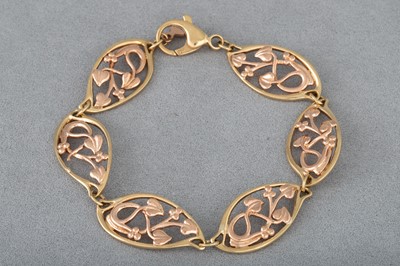 Lot 89 - A GOLD BRACELET, shaped openwork panels