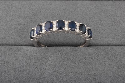 Lot 94 - A DIAMOND AND SAPPHIRE RING, mounted in 18ct...