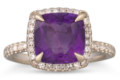 Lot 106 - A DIAMOND AND AMETHYST CLUSTER RING, mounted...