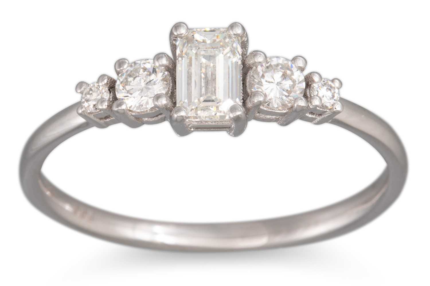 Lot 71 - A DIAMOND FIVE STONE RING, the emerald cut...