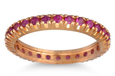 Lot 244 - A RUBY ETERNITY RING, mounted in 18ct yellow...