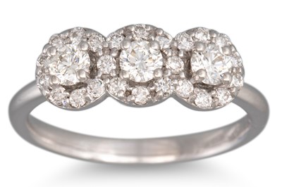 Lot 245 - A DIAMOND TRIPLE CLUSTER RING, 'halo' style,...