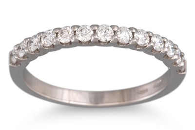 Lot 251 - A DIAMOND HALF ETERNITY RING, the brilliant...