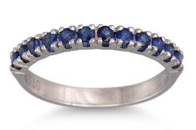 Lot 253 - A SAPPHIRE HALF ETERNITY RING, mounted in 18ct...