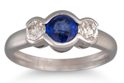 Lot 254 - A SAPPHIRE AND DIAMOND THREE STONE RING,...