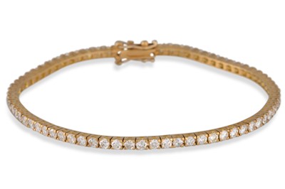 Lot 270 - A DIAMOND LINE BRACELET, set with brilliant...