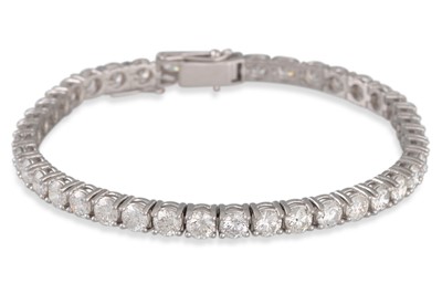 Lot 271 - A DIAMOND LINE BRACELET, the brilliant cut...