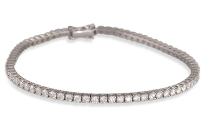 Lot 272 - A DIAMOND LINE BRACELET, the brilliant cut...