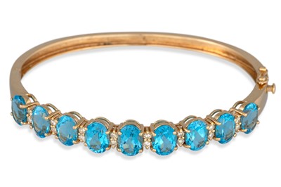 Lot 129 - A 14CT YELLOW GOLD HINGED BRACELET, set with...