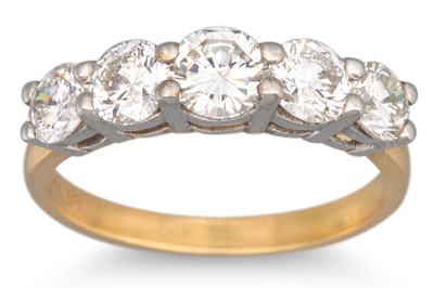 Lot 329 - A DIAMOND FIVE STONE RING, the graduated round...