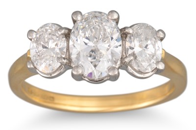 Lot 331 - A THREE STONE DIAMOND RING, set with oval...