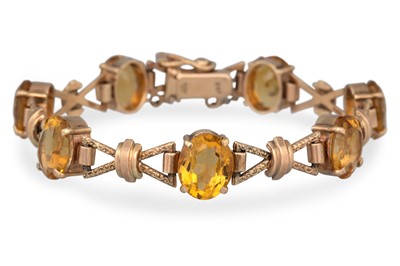 Lot 96 - A 9CT YELLOW GOLD FLEXIBLE CITRINE SET...