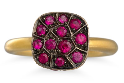 Lot 191 - A RUBY CLUSTER RING, pavé set in 18ct yellow...