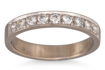 Lot 141 - A DIAMOND HALF ETERNITY RING, the round...