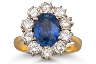 Lot 1 - A SAPPHIRE AND DIAMOND CLUSTER RING, mounted...