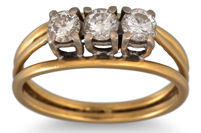 Lot 20 - A THREE STONE DIAMOND RING, mounted in 18ct...