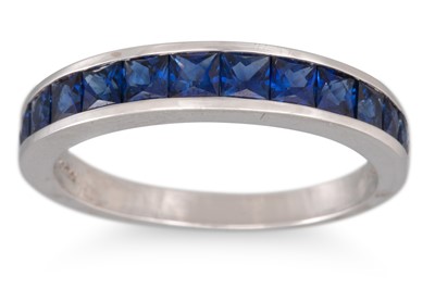 Lot 345 - A SAPPHIRE CHANNEL SET BAND RING, French cut...