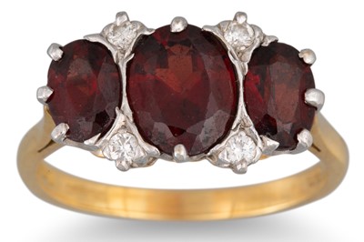 Lot 20 - A GARNET AND DIAMOND RING, mounted in 18ct...