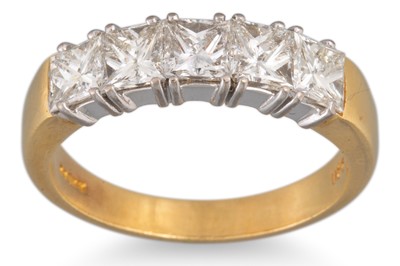 Lot 23 - A FIVE STONE DIAMOND RING, the princess cut...