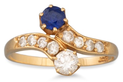 Lot 17 - A SAPPHIRE AND DIAMOND CROSS-OVER RING,...