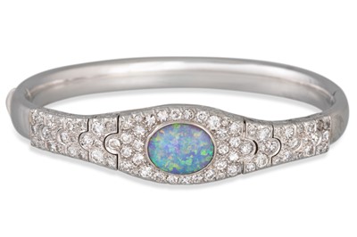 Lot 110 - AN OPAL AND DIAMOND BANGLE, the oval opal to...