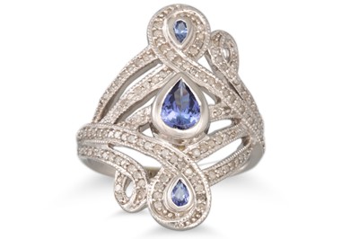 Lot 120 - A DIAMOND AND TANZANITE DRESS RING, mounted in...