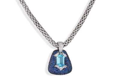 Lot 127 - A TOPAZ AND BLUE SAPPHIRE PENDANT, the...